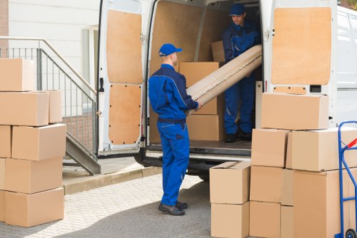Commercial moving truck loading office equipment in France