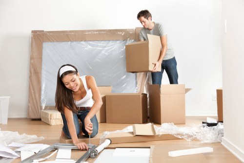 Professional movers handling household items in France