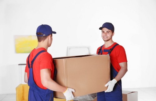 Professional office movers handling equipment