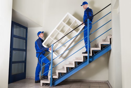 Professional movers handling furniture