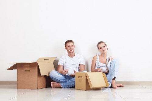 Professional movers handling large office furniture