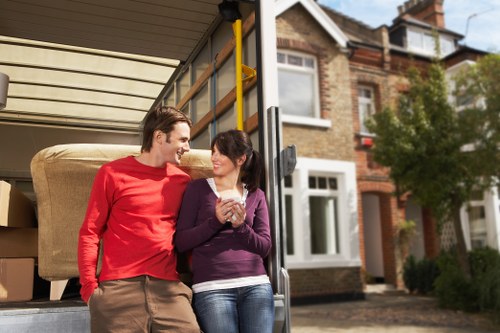 Customers discussing their removal needs with a man and van service